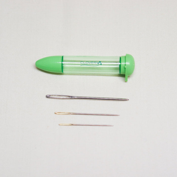 3 piece clover darning needles of varying sized with plastic storage tube.