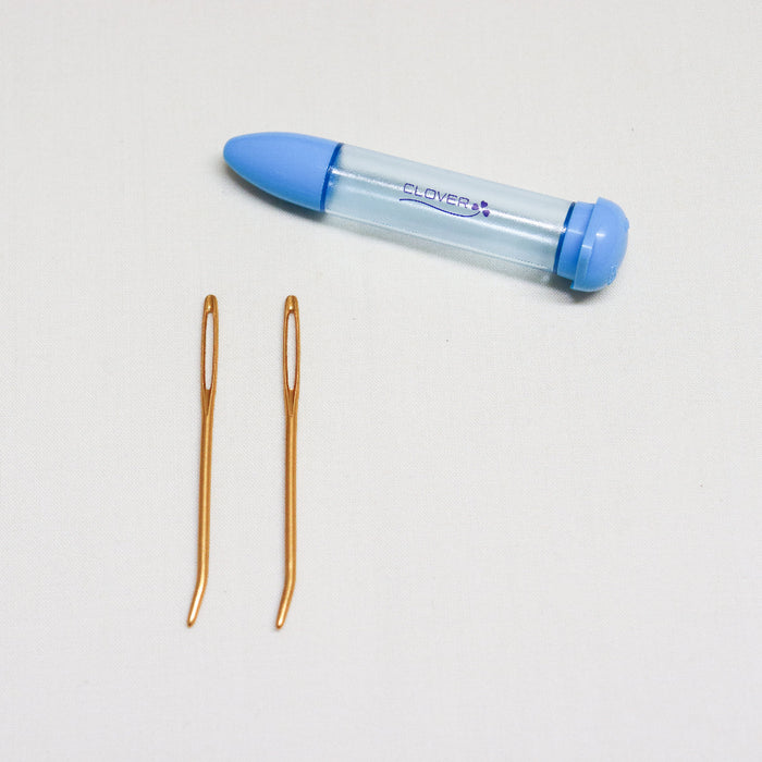 2 piece clover darning needles with bent tips and plastic storage tube.